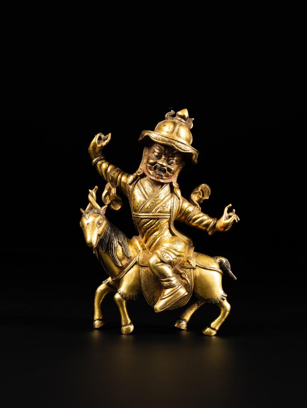 View full screen - View 1 of Lot 21. A gilt-bronze figure of a Pehar, Qing dynasty, 18th century | 清十八世紀 銅鎏金白哈爾王坐像.