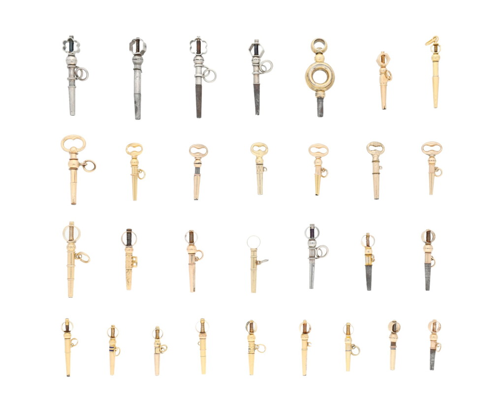 View full screen - View 1 of Lot 199. A group of gold, gilt-metal and silver keys.
