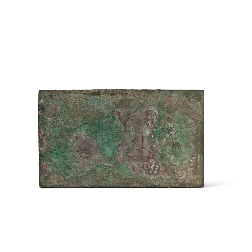 View full screen - View 1 of Lot 632. A rare incised bronze 'figural' plaque, Han dynasty, possibly Dian Kingdom of Yunnan | 漢 或雲南滇國 銅鏨巫師紋牌.