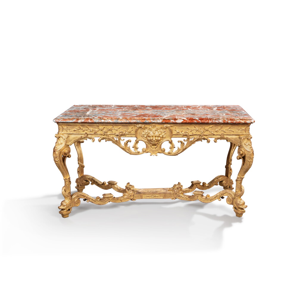 View full screen - View 1 of Lot 50. A Régence carved giltwood centre table, circa 1720, after a drawing by Jean-Bernard Turreau, dit Toro.