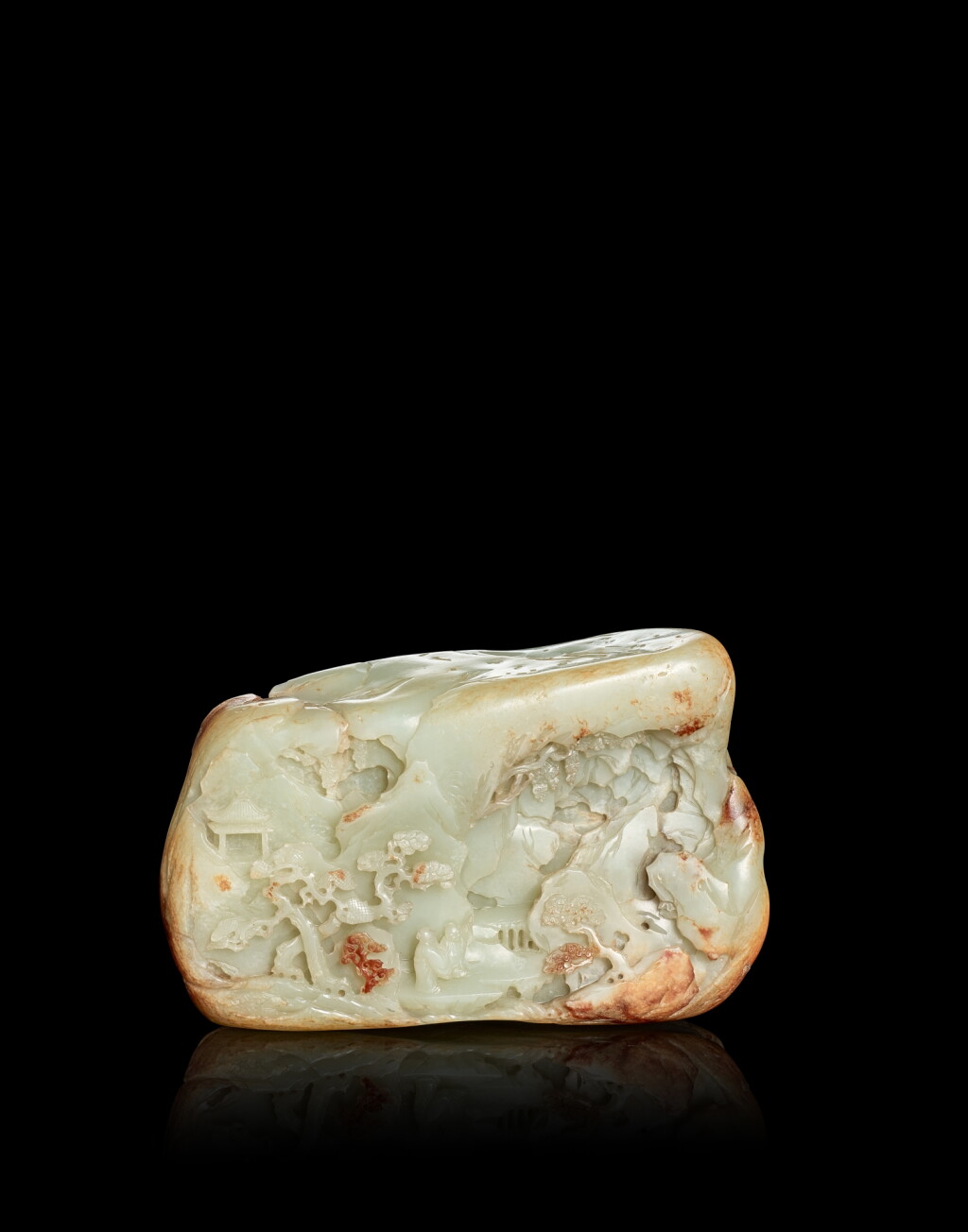 View full screen - View 1 of Lot 3821. A celadon and russet jade boulder, Qing dynasty, Qianlong period | 清乾隆 青白玉僧人引路圖山子.