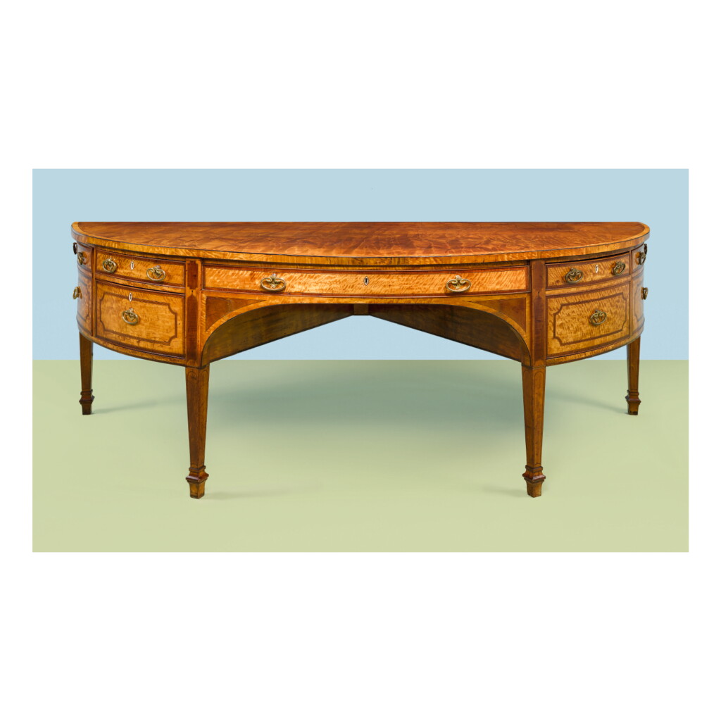 View full screen - View 1 of Lot 188. A GEORGE III SATINWOOD AND HAREWOOD DEMI-LUNE SIDEBOARD, LATE 18TH CENTURY.