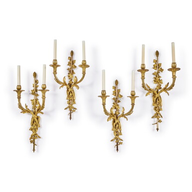 View full screen - View 1 of Lot 31. An Assembled Set of Four Louis XVI Gilt-Bronze Two-Branch Wall Lights, One late 18th Century, Three 18th/19th Century.