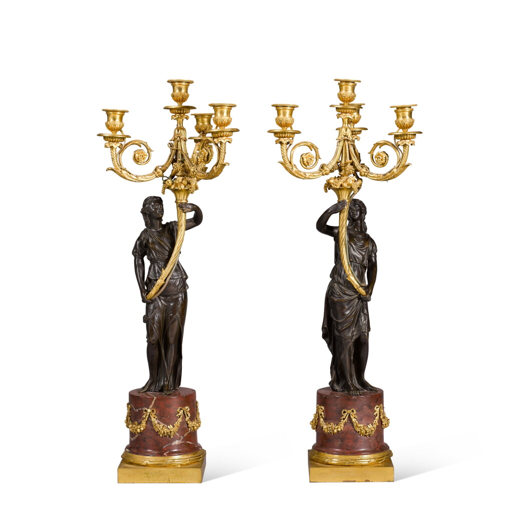 View full screen - View 1 of Lot 63. A pair of Louis XVI style gilt and patinated bronze four-light candelabra, late 19th century.