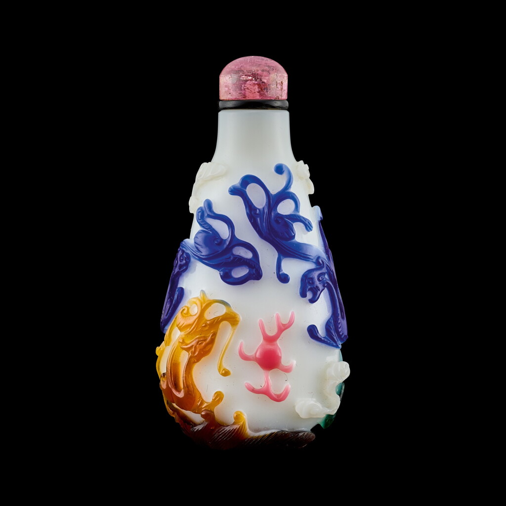 View full screen - View 1 of Lot 1008. A five-colour overlay white glass 'dragons' snuff bottle Qing dynasty, 18th - 19th century | 清十八至十九世紀 涅白地套五色彩料龍紋鼻煙壺.