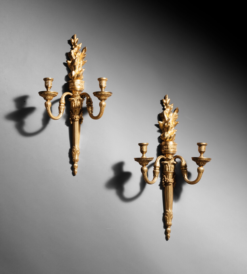 View full screen - View 1 of Lot 111. A pair of gilt-bronze wall appliques, French Restauration, circa 1820, after a drawing by Jean-Louis Prieur (1732-1795) | Paire d’appliques au brandon en bronze doré d’époque Restauration, vers 1820, d’après un dessin de Jean-Louis Prieur (1732-1795) .