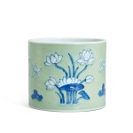A celadon-ground underglaze-blue 'lotus pond' brushpot, Qing dynasty, Kangxi period 清康熙 粉青地青花荷塘紋筆筒