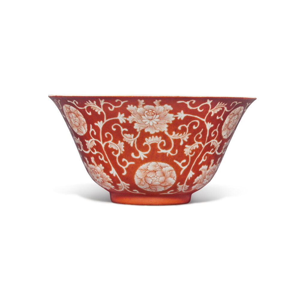 View full screen - View 1 of Lot 109. A coral-ground reverse-decorated 'lotus' bowl, Seal mark and period of Qianlong.