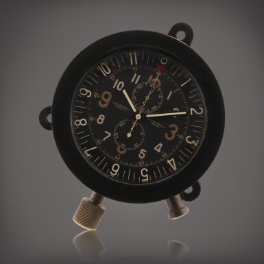View full screen - View 1 of Lot 173. Reference 1363, retailed by A. Cairelli Horloge militaire en bakelite avec chronographe | Military bakelite chronograph clock Vers 1950 | Circa 1950.