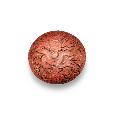 View full screen - View 1 of Lot 123. A carved cinnabar lacquer 'dragon' box and cover, Ming dynasty, 17th century | 明十七世紀 剔紅龍紋蓋盒.
