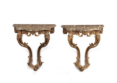 View full screen - View 1 of Lot 28. A pair of Louis XV carved oak console tables, circa 1755 | Paire de consoles en chêne sculpté d'époque Louis XV, vers 1755.