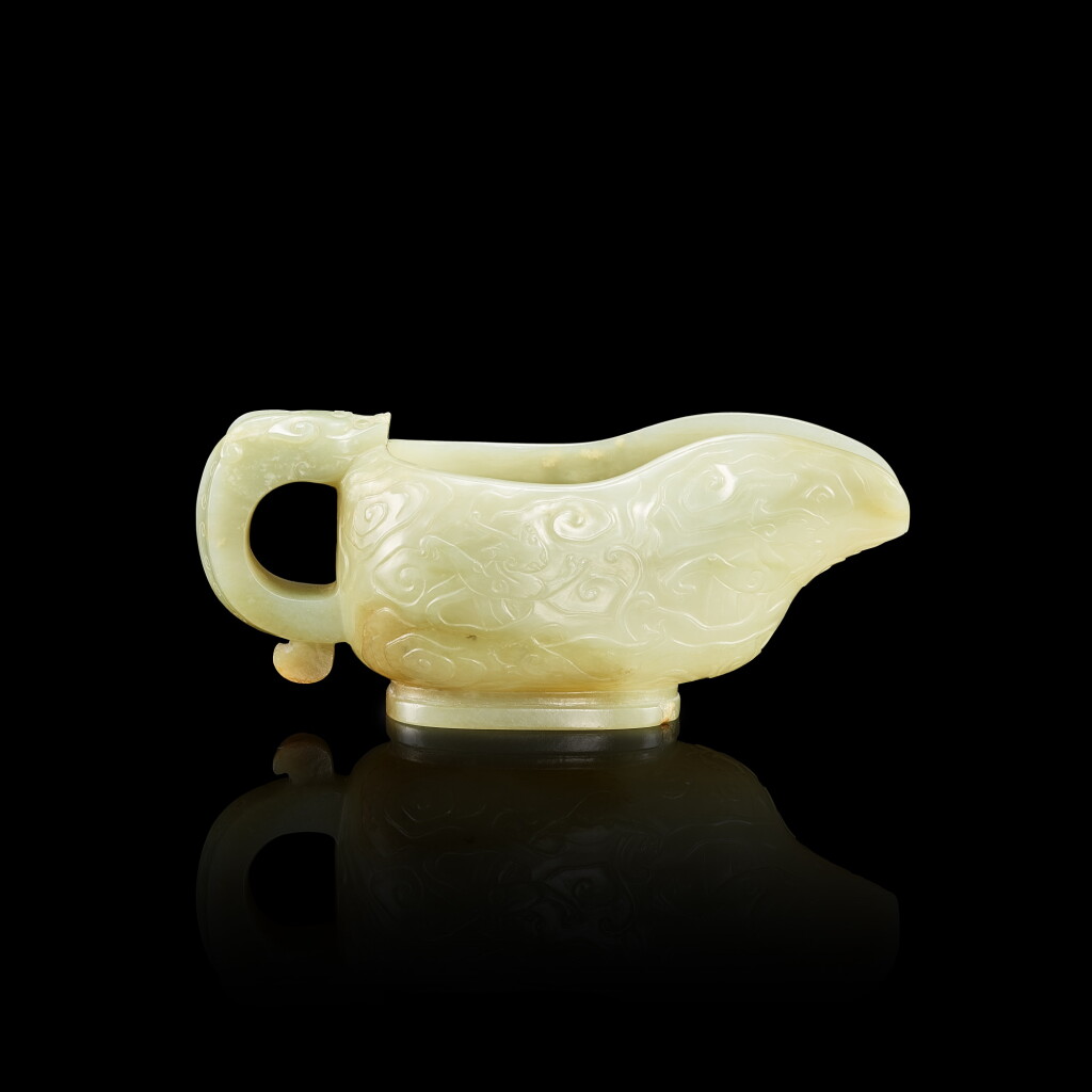 View full screen - View 1 of Lot 3030. A celadon jade archaistic 'dragon' vessel, yi, 17th century 十七世紀 青玉仿古龍紋匜.
