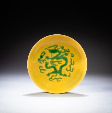 View full screen - View 1 of Lot 114. A yellow-ground green-enamelled 'dragon' dish, Mark and period of Guangxu | 清光緒 黃地綠彩刻龍紋盤 《大清光緒年製》款.