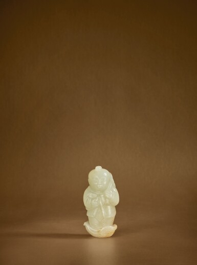 View full screen - View 1 of Lot 125. A pale green jade carving of a boy, Yuan dynasty .