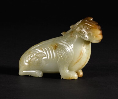View full screen - View 1 of Lot 211. A RARE CELADON AND RUSSET JADE FIGURE OF A MYTHICAL BEAST MING DYNASTY | 明 褐斑青玉瑞獸.