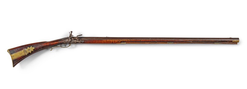 View full screen - View 1 of Lot 498. Extremely Rare and Fine Carved and Figured Maple, Engraved Brass and Steel Flintlock American Long Rifle, John George Rupp (1721-1807), Macungie Township, Lehigh County, Pennsylvania, Circa 1775.