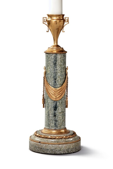 View full screen - View 1 of Lot 571. A Pair of Swedish Neoclassical Gilt-Bronze Mounted Grey Porphyry Candlesticks, Late 18th Century, Together with a Pair of Empire Gilt-Bronze Candlesticks, 19th Century Now Mounted as Lamps.