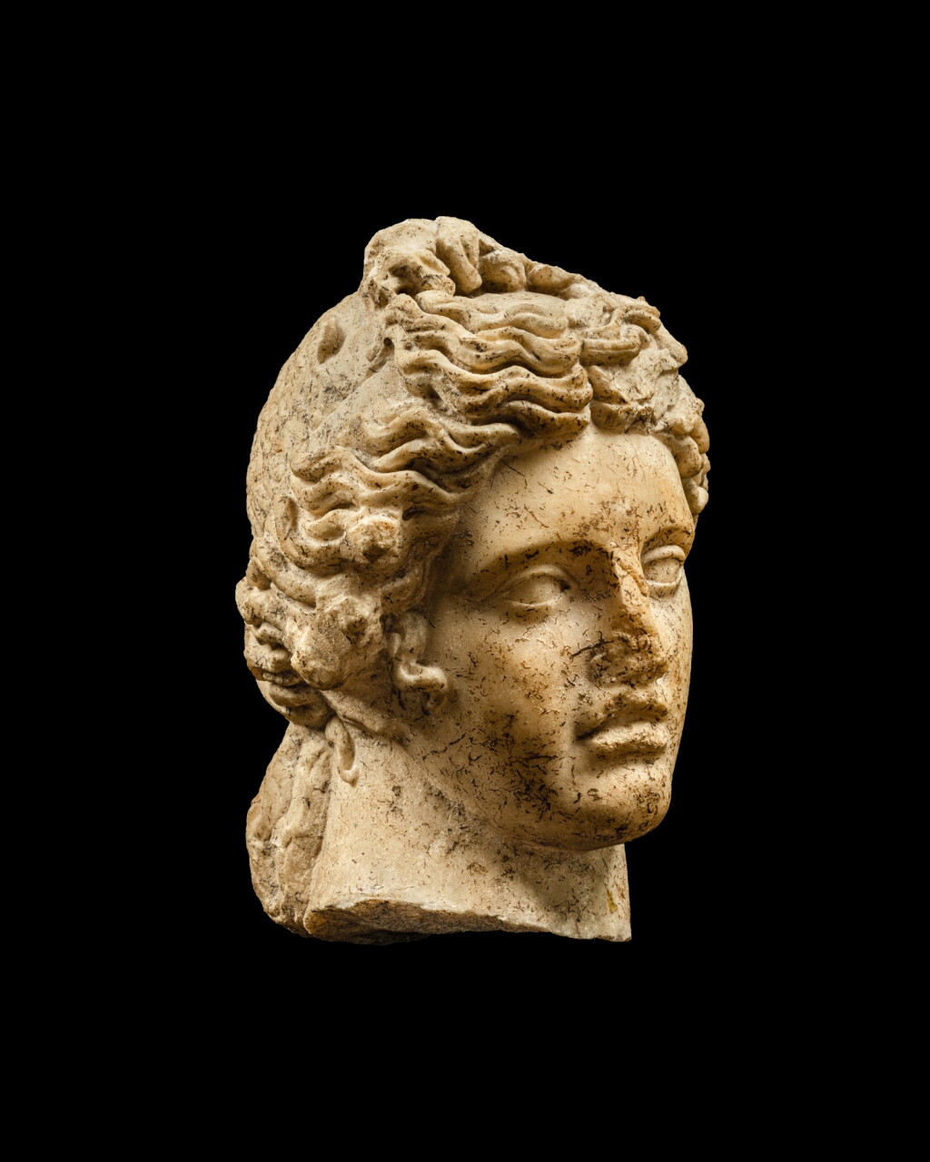 View full screen - View 1 of Lot 57. A Roman Marble Head of Apollo, 1st Century A.D..