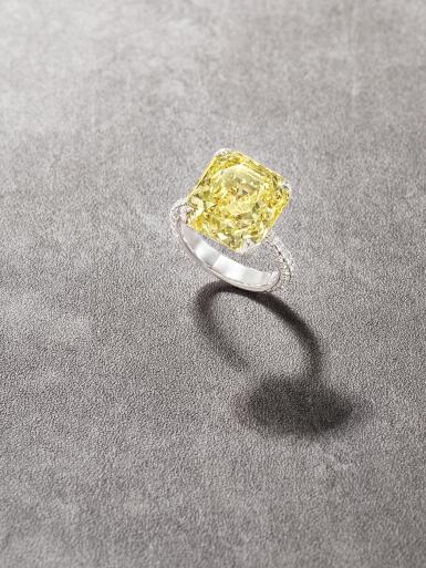 View full screen - View 1 of Lot 23. Fancy Intense Yellow Diamond and Diamond Ring.