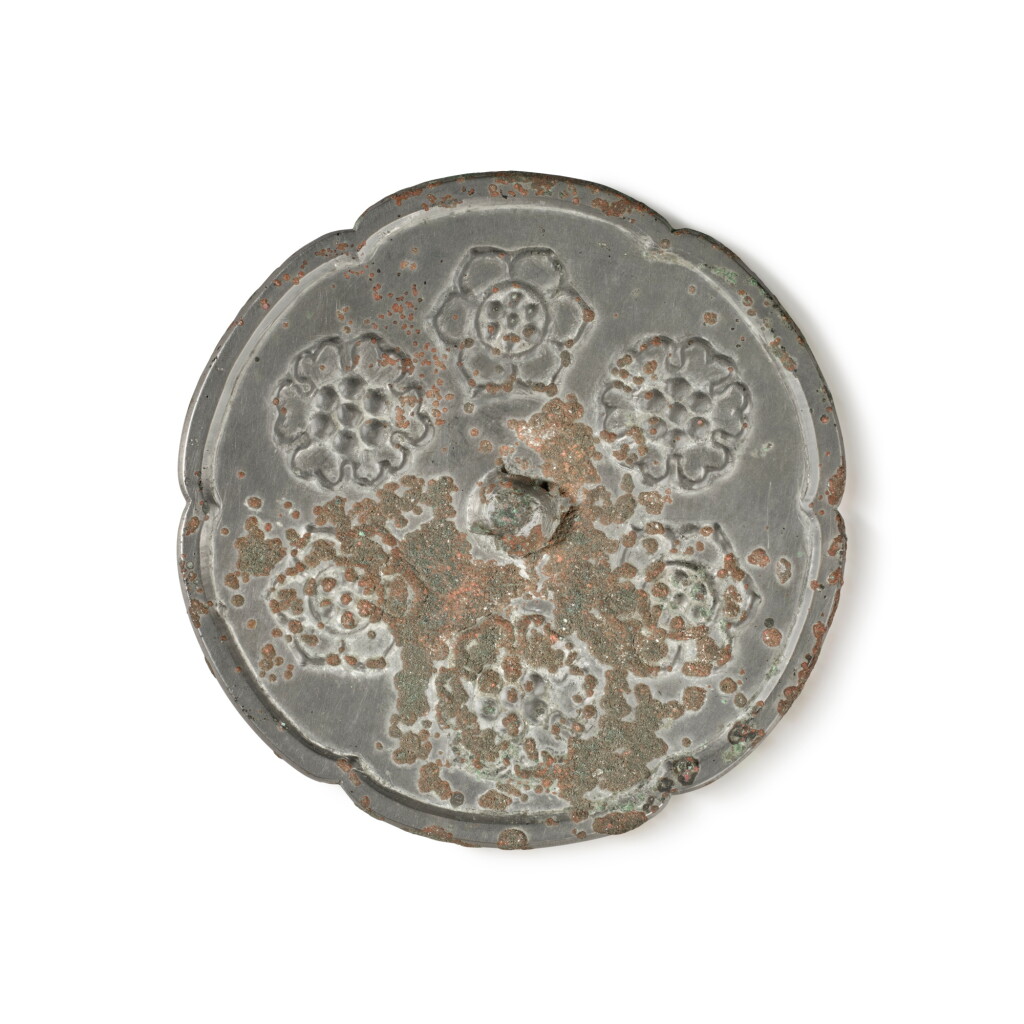 View full screen - View 1 of Lot 894. A silvered bronze 'floral' mirror, Tang dynasty | 唐 寶相花紋鏡.