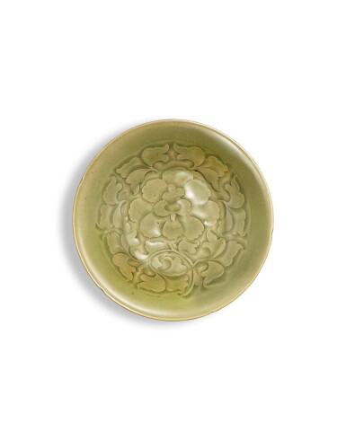 View full screen - View 1 of Lot 2004. A carved Yaozhou celadon 'peony' dish, Northern Song dynasty | 北宋 耀州青釉刻牡丹紋葵口盤.