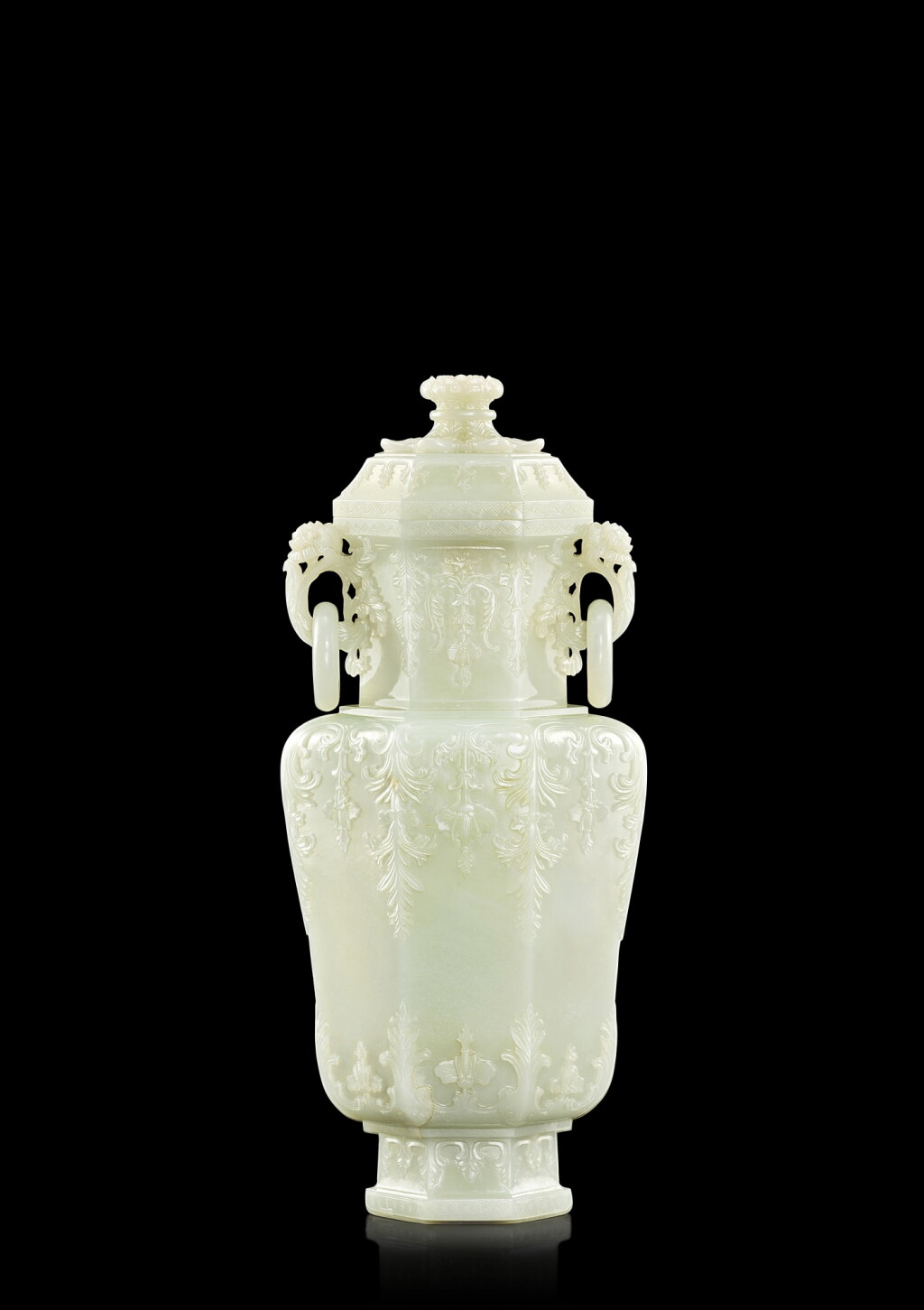 View full screen - View 1 of Lot 3632. A finely carved white jade Mughal-style hexagonal vase and cover, Qing dynasty, Qianlong period | 清乾隆 白玉痕都斯坦式莨菪葉紋六方活環耳蓋壺.