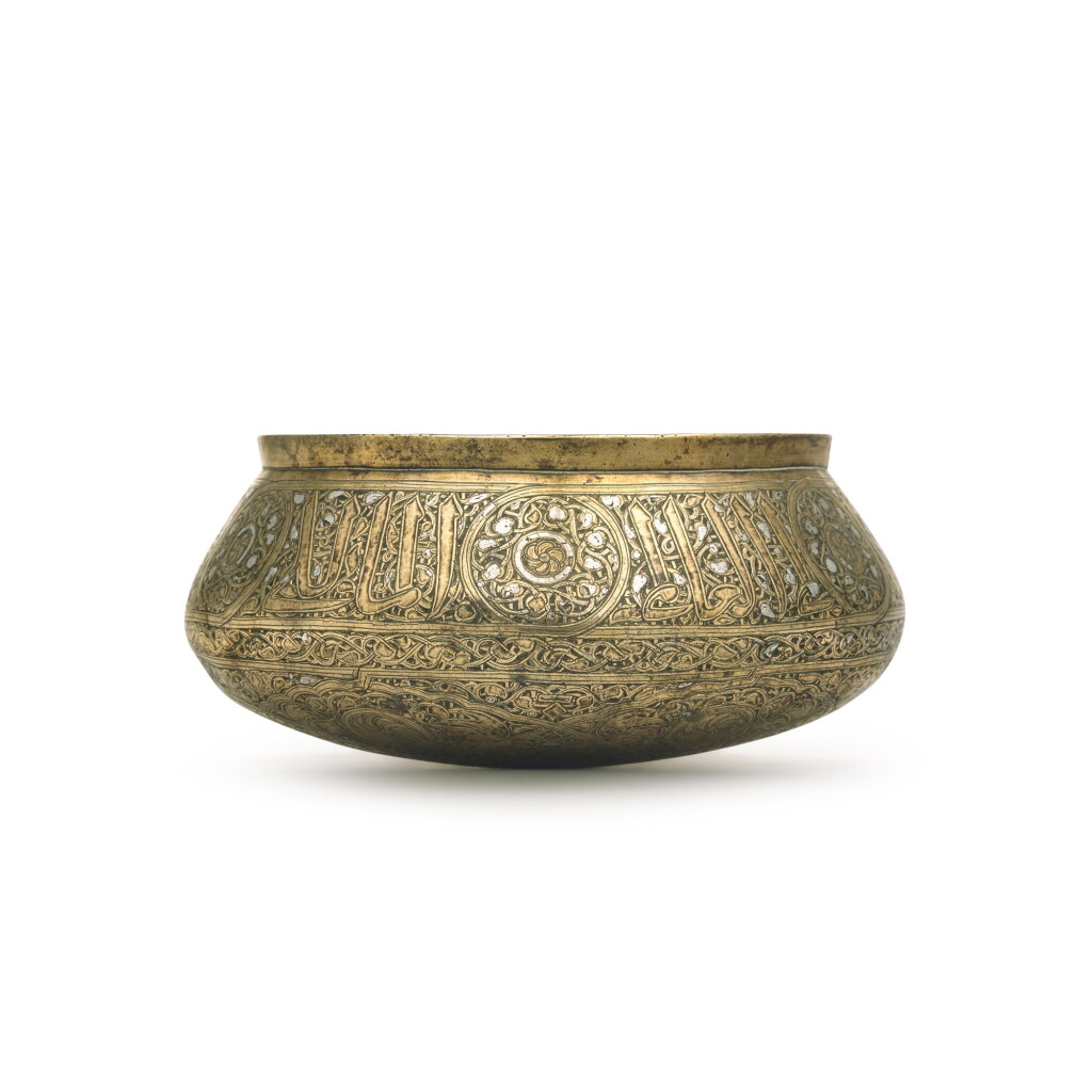 View full screen - View 1 of Lot 72. A Mamluk silver-inlaid cast brass bowl, Egypt or Syria, late 13th/early 14th century.
