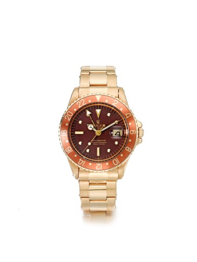 View full screen - View 1 of Lot 40. ROLEX | REFERENCE 1675 GMT-MASTER 'NIPPLE DIAL' A YELLOW GOLD AUTOMATIC DUAL TIME WRISTWATCH WITH DATE AND BRACELET, CIRCA 1969.