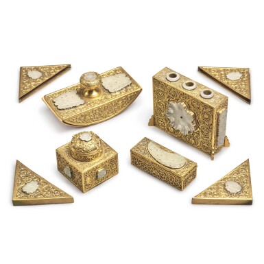 View full screen - View 1 of Lot 59. An eight-piece gilt-metal and jade-inlaid assembled desk set, 20th century | 二十世紀 金屬鎏金卷草吉祥紋案套装文具八件.