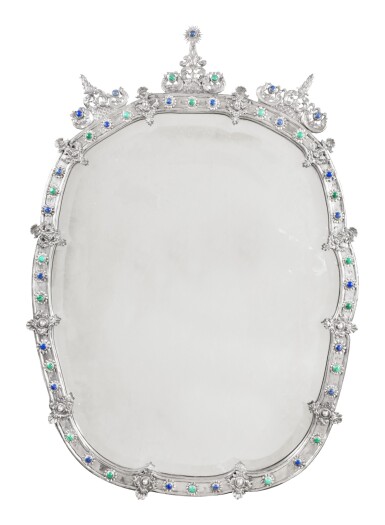 View full screen - View 1 of Lot 123. A large oval silver and hardstones mirror, probably Segovia circa 1760 by a member of the Najera family | Grand miroir ovale en argent serti de pierres dures, probablement Ségovie vers 1760 par un membre de la famille de Najera.