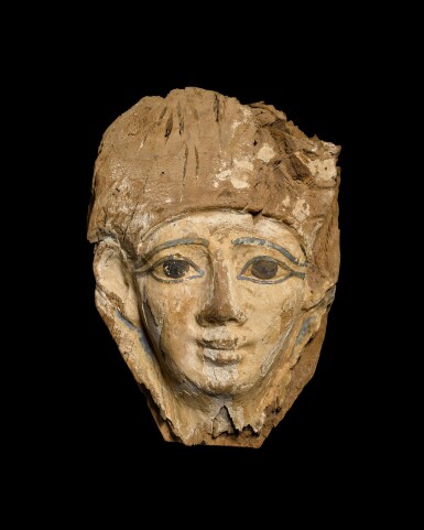 View full screen - View 1 of Lot 125. An Egyptian Wood Mummy Mask, 20th Dynasty, 1190-1075 B.C..