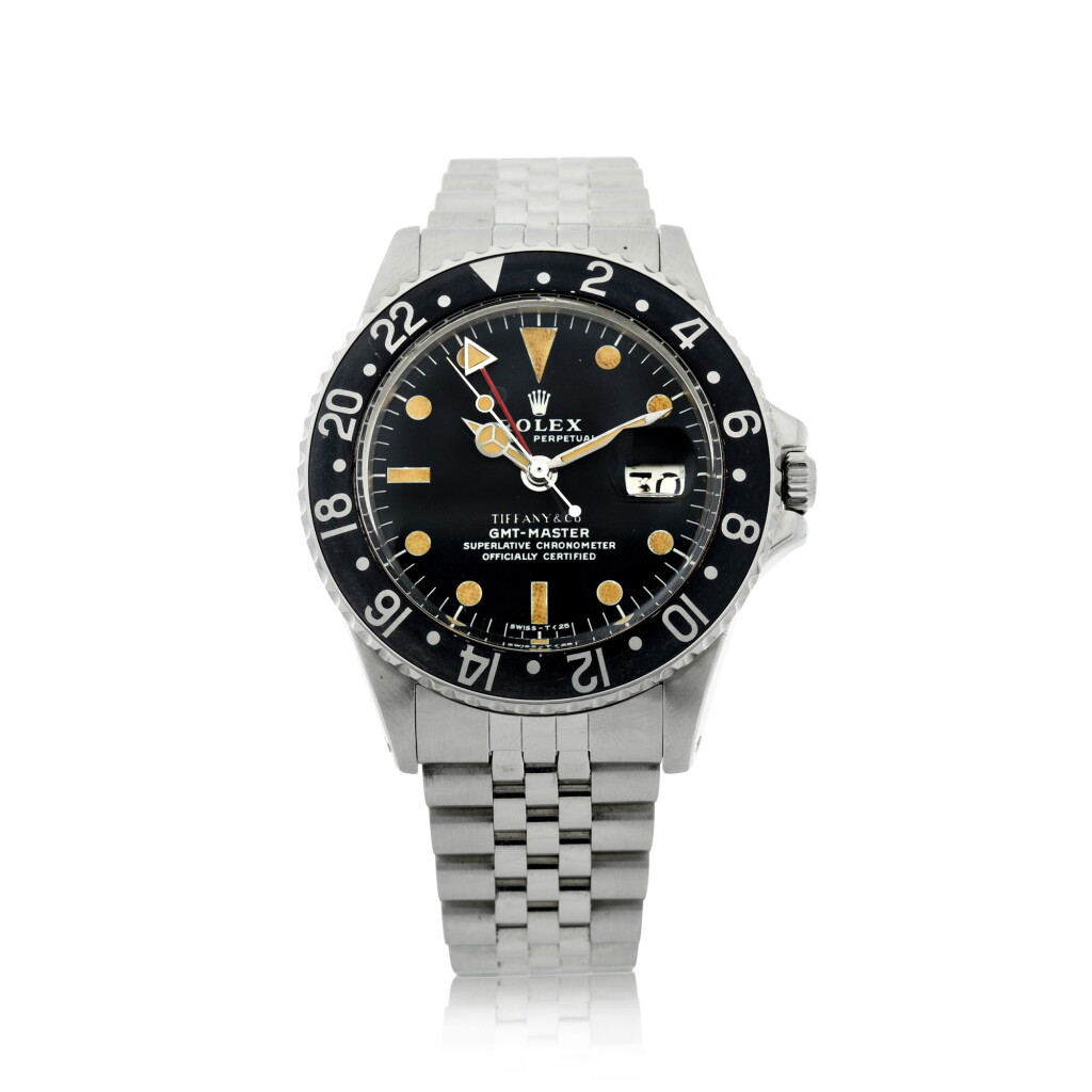 View full screen - View 1 of Lot 66. REFERENCE 1675 GMT-MASTER RETAILED BY TIFFANY & CO.: A STAINLESS STEEL AUTOMATIC DUAL-TIME WRISTWATCH WITH DATE AND BRACELET, CIRCA 1972.