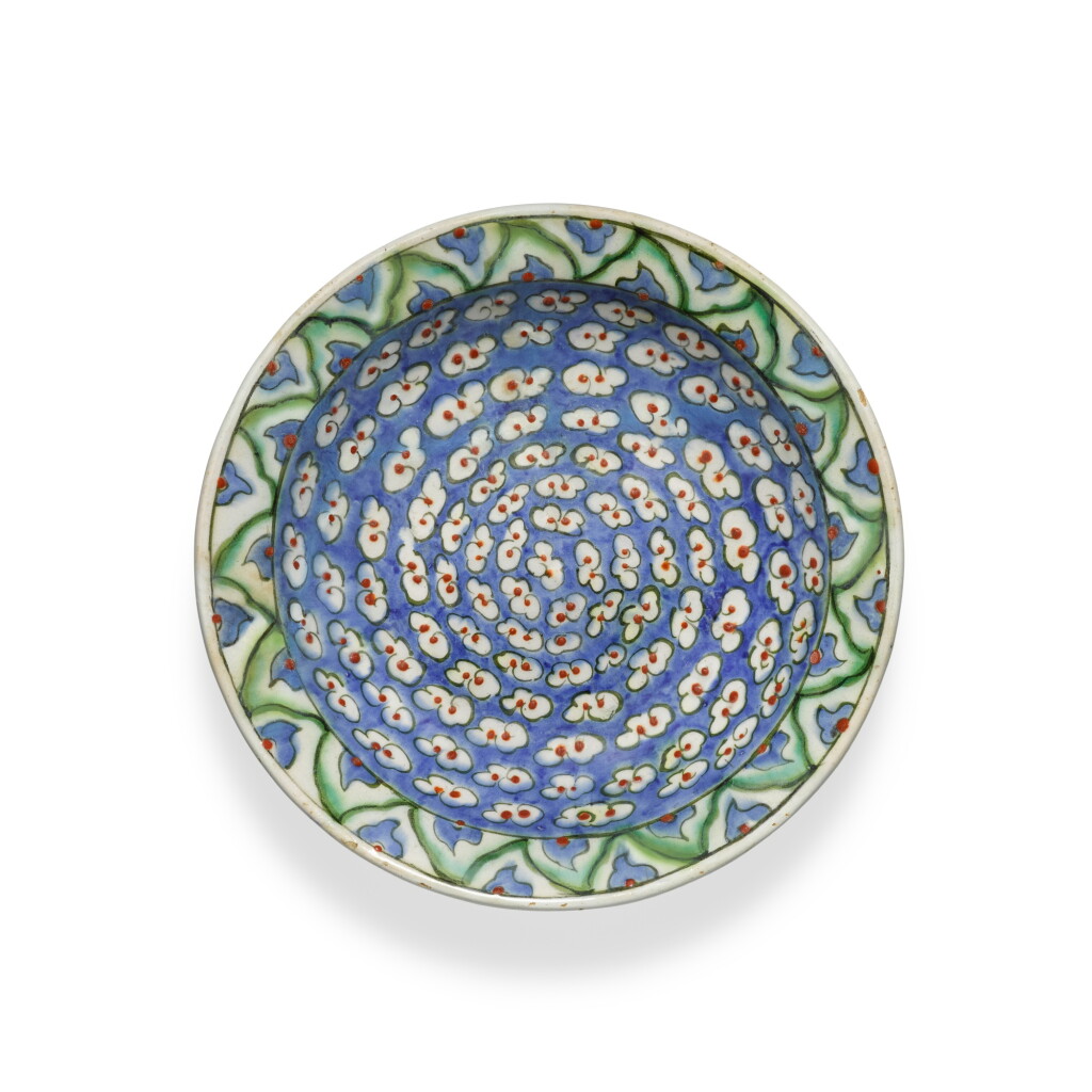 View full screen - View 1 of Lot 147. An Iznik polychrome pottery dish with stylised cloud design, Turkey, circa 1580.