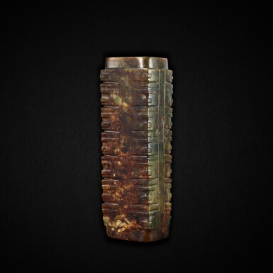 View full screen - View 1 of Lot 3784. A rare green and russet 'human face' jade cong, Neolithic period, Liangzhu culture, circa 2500-2000 BC | 新石器時代 良渚文化 約公元前二千五至二千年 人面紋玉琮.