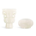 A white jade archaistic gu vase and a circular box and cover, Late Qing dynasty 晚清 白玉雕仿古活環耳花觚及圓蓋盒一組兩件