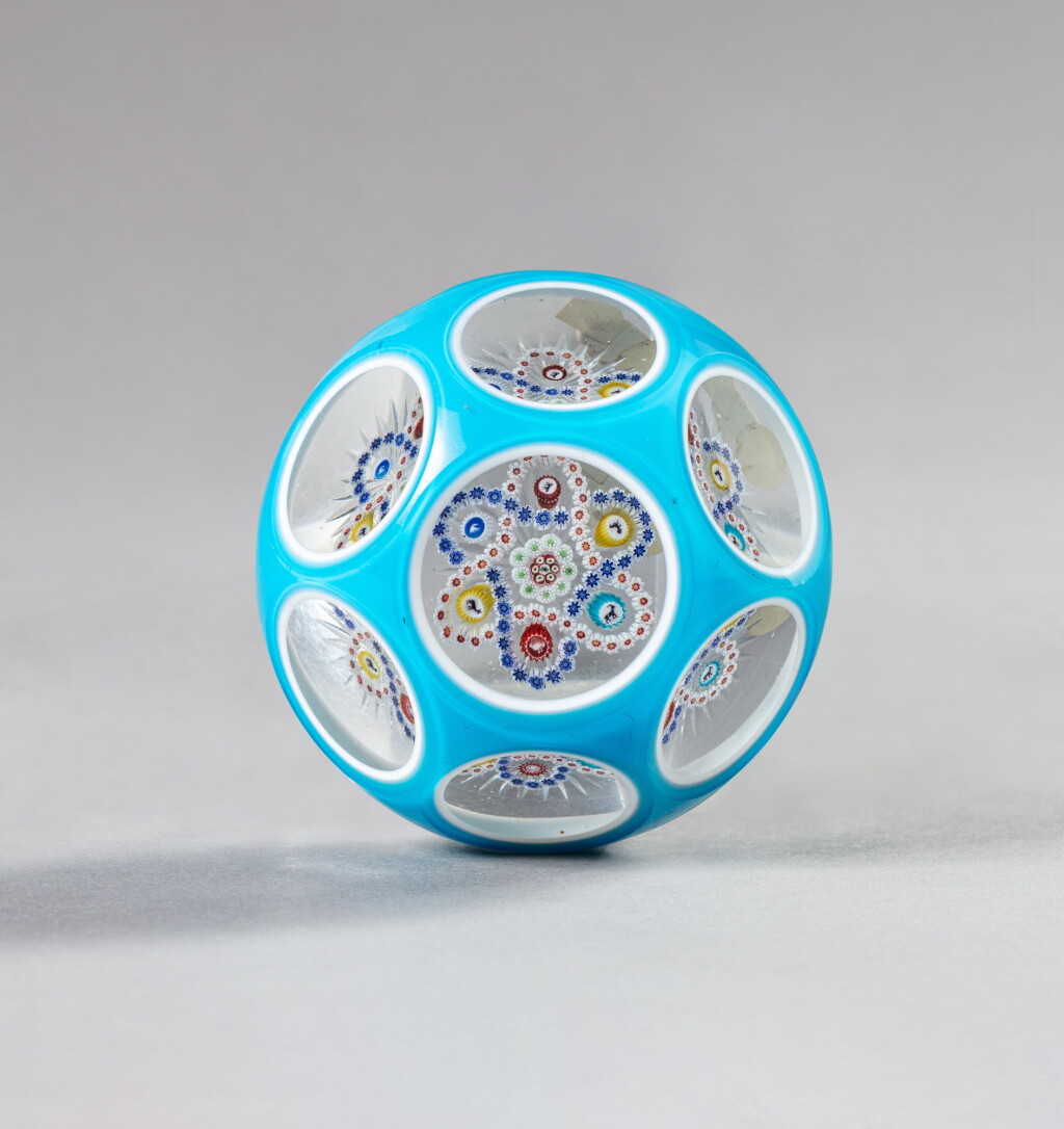 View full screen - View 1 of Lot 704. A Baccarat double-overlay faceted garland millefiori paperweight, circa 1850.