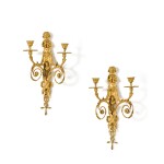 A pair of Louis XVI style gilt-bronze two-light wall appliques after a model by Gouthière, late 19th century