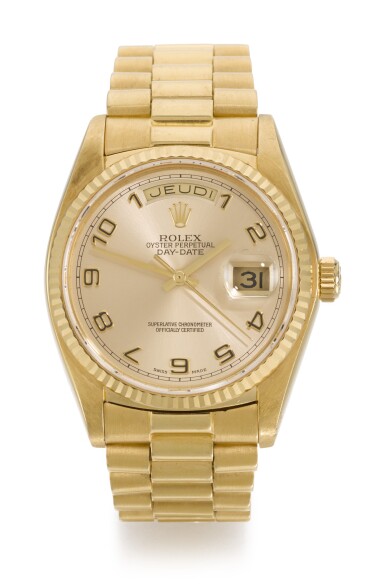 View full screen - View 1 of Lot 6. ROLEX | DAY-DATE, REFERENCE 18038, YELLOW GOLD WRISTWATCH WITH DAY, DATE AND BRACELET, CIRCA 1979.