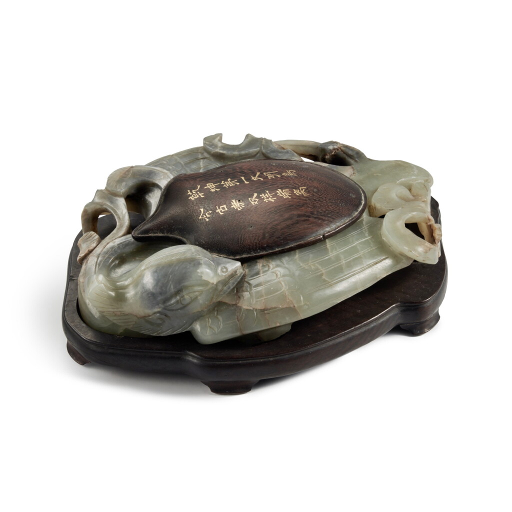 View full screen - View 1 of Lot 9. A gray and celadon jade 'phoenix' inkstone, Ming dynasty | 明 青灰玉雕鳳形硯.