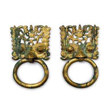 View full screen - View 1 of Lot 248. A rare pair of gilt-bronze mask and ring handles, Northern Wei dynasty | 北魏 銅鎏金透空鋪首活環一對.