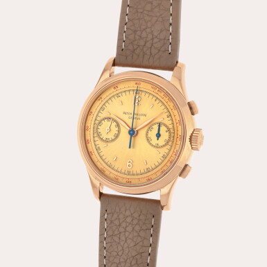 View full screen - View 1 of Lot 21. Reference 530 | A pink gold chronograph wristwatch with pink satin sunburst dial | Made in 1952.