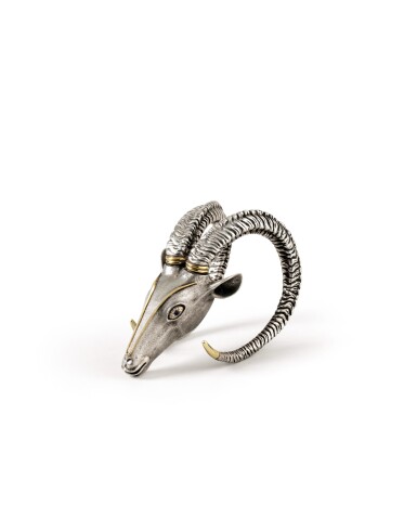 View full screen - View 1 of Lot 92. A FRENCH PARCEL-GILT SILVER PAPERWEIGHT SHAPED AS A MOUNTAIN GOAT HEAD BY CHAUMET, PARIS, CIRCA 1960 | PRESSE-PAPIER EN FORME DE TÊTE DE BOUQUETIN EN ARGENT ET VERMEIL PAR CHAUMET, PARIS, VERS 1960.