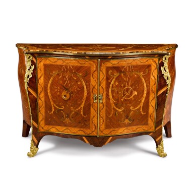 View full screen - View 1 of Lot 39. A George III padouk, tulipwood, marquetry and gilt-metal-mounted commode, circa 1770, attributed to Pierre Langlois.