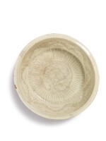 A large 'Cizhou' white-glazed 'peony' basin, Song dynasty