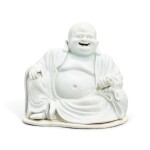 A Dehua figure of Budai, Qing dynasty, 19th century 清十九世紀 德化布袋和尚坐像
