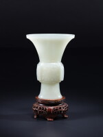 A white jade 'taotie' gu-form vase, Qing dynasty, Qianlong period