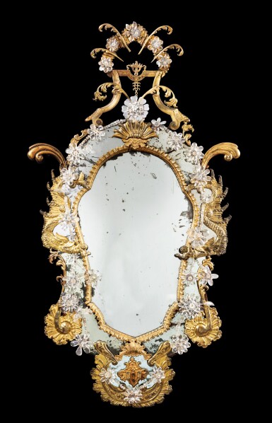View full screen - View 1 of Lot 1. A gilt-copper and rock crystal mirror, Naples, circa 1750 | Miroir à fronton en cuivre doré et cristal de roche, travail napolitain, vers 1750.