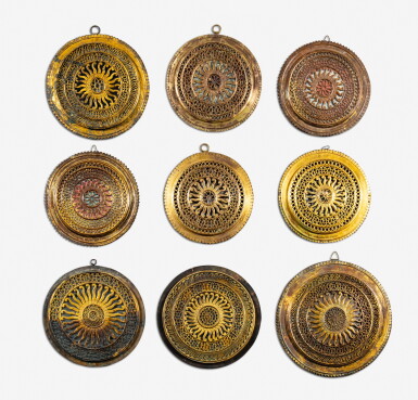 View full screen - View 1 of Lot 78. A set of nine gilt-copper chakras, India, 19th/20th century | Ensemble de neuf chakras en cuivre doré, Inde, XIXe / XXe siècle.