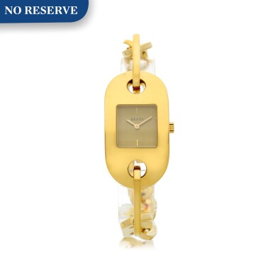 View full screen - View 1 of Lot 86. A GOLD PLATED RECTANGULAR BRACELET WATCH, CIRCA 2000.