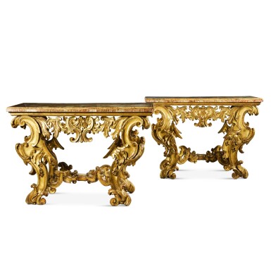 View full screen - View 1 of Lot 67. A pair of Italian Baroque carved giltwood console tables, Rome, late 17th century/early 18th century.
